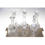 Five crystal glass decanters and stoppers.