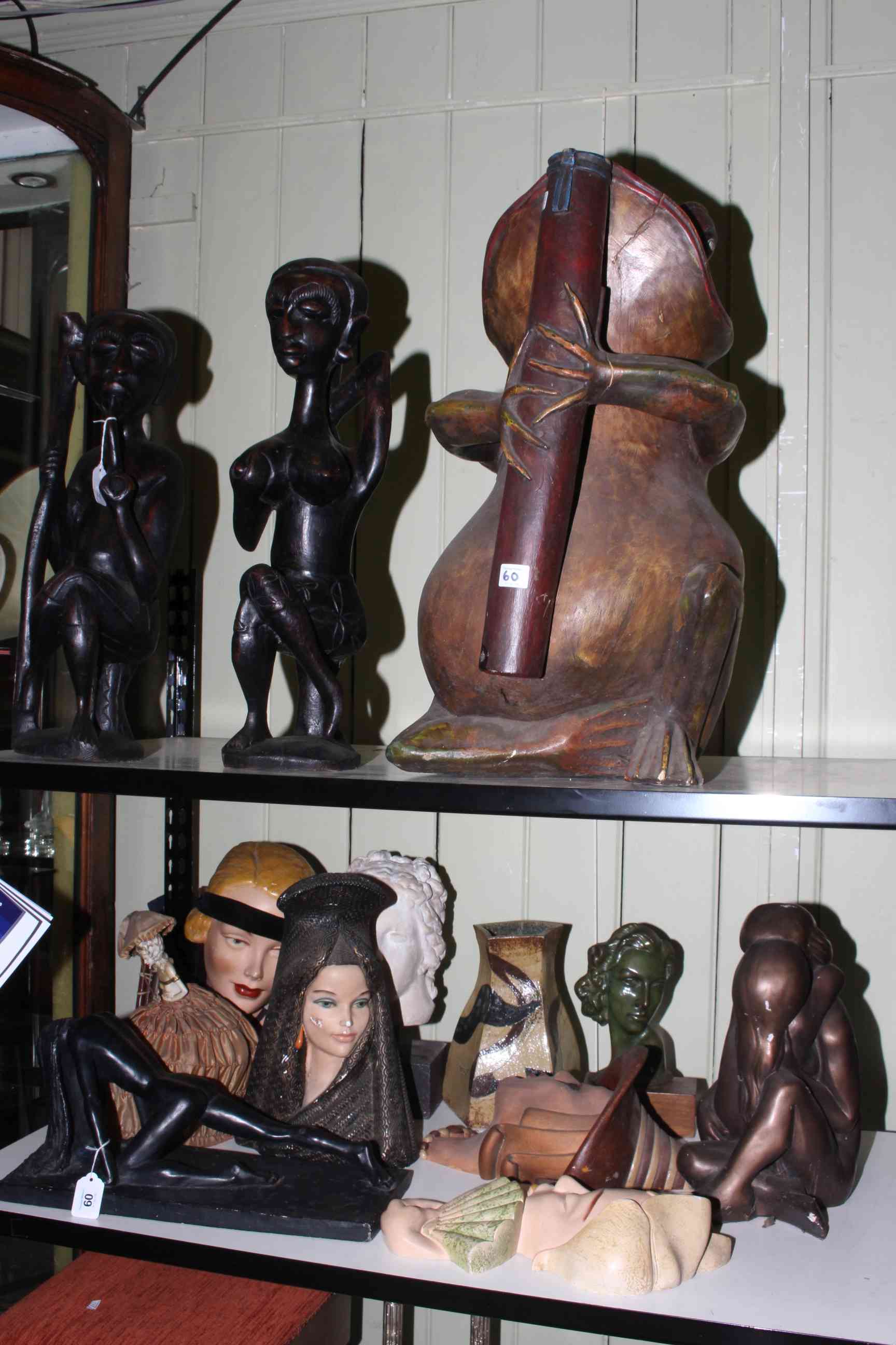 Pair of ethnic carved figures, large model of frog, bust, face masks, bronzed female nude, etc.