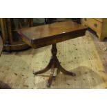 Mahogany fold top writing/card table on pedestal base, 76cm by 85cm (closed).