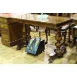 Victorian rosewood centre table raised on turned pillars to four bun feet, 75.5cm by 121.5cm.