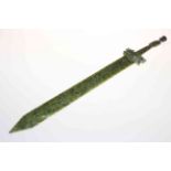 Chinese green jade sword, carved with beast hilt and elder finial.