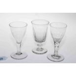 Collection of three antique wine glasses.