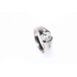Platinum and diamond ladies ring with central diamond and three to each shoulder stamped 1.