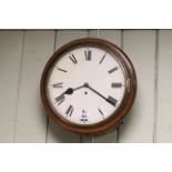 Circular cased fusee wall clock.