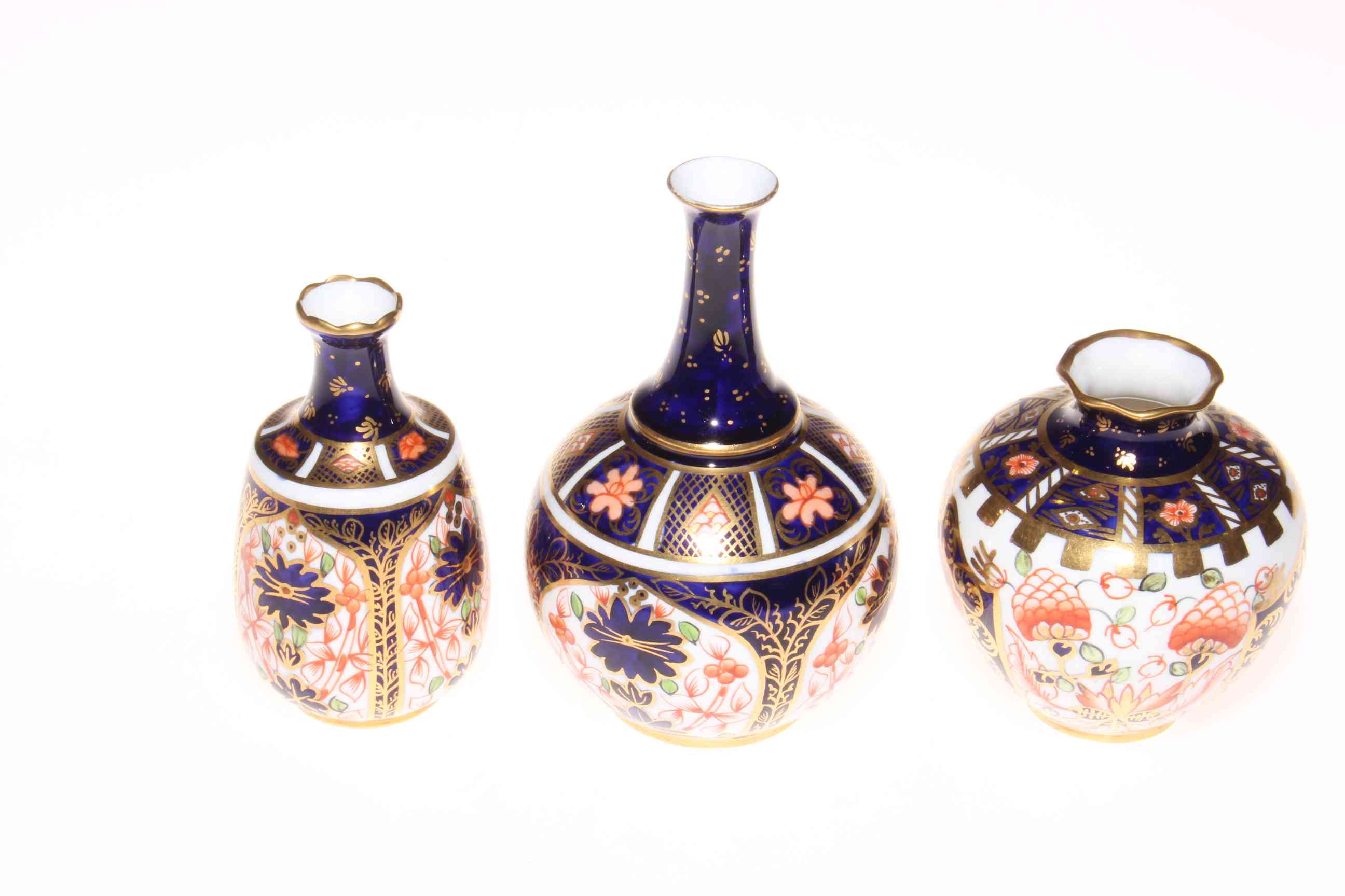 Three Royal Crown Derby vases.