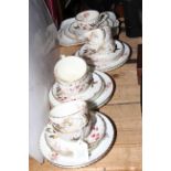 Twenty four piece Victorian part tea service with bird, berry and butterfly decoration.