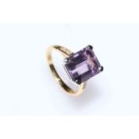 18 carat gold and amethyst ring with three diamonds to each shoulder, size N½.