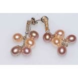 Pair of cultured pearl and diamond drop earrings set in 18 carat white gold.