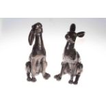 Two bronzed effect models of seated hares.