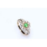 Green garnet and diamond petal design ring with four diamonds to each shoulder, in yellow gold,