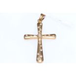 18 carat yellow gold and diamond cross pendant.