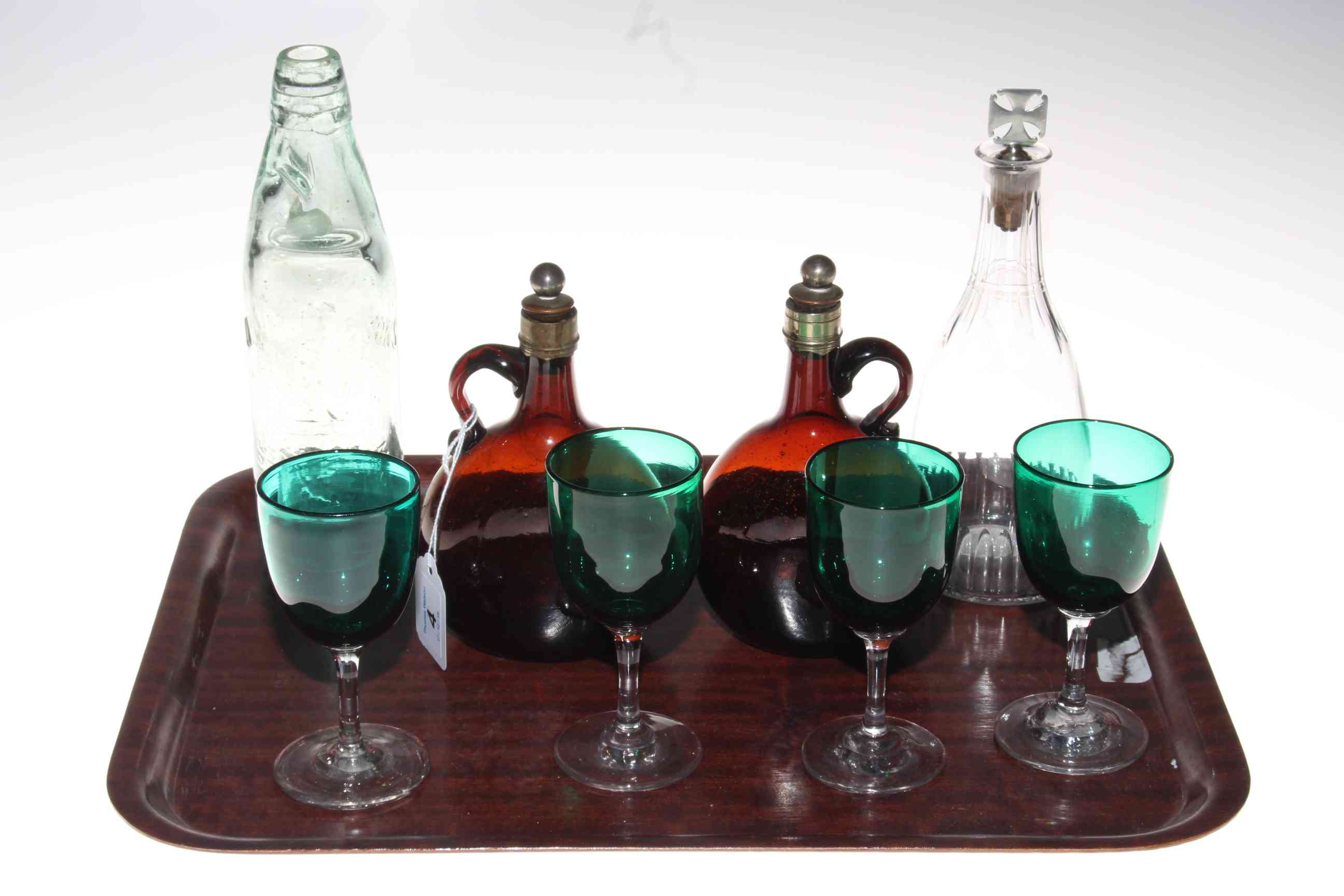 Small 19th Century decanter, two brown glass bottles, four green wine glasses and vintage bottle.