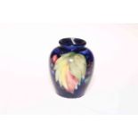 Small Moorcroft pottery leaf and berry vase.