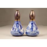 Pair of early 20th Century Royal Doulton vases, Gourd shaped with gilt detail from the Blue Children