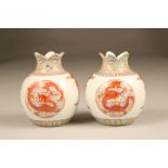 Pair 20th Century Chinese vases, spherical form, with lobed rims, decorated with iron red dragons,