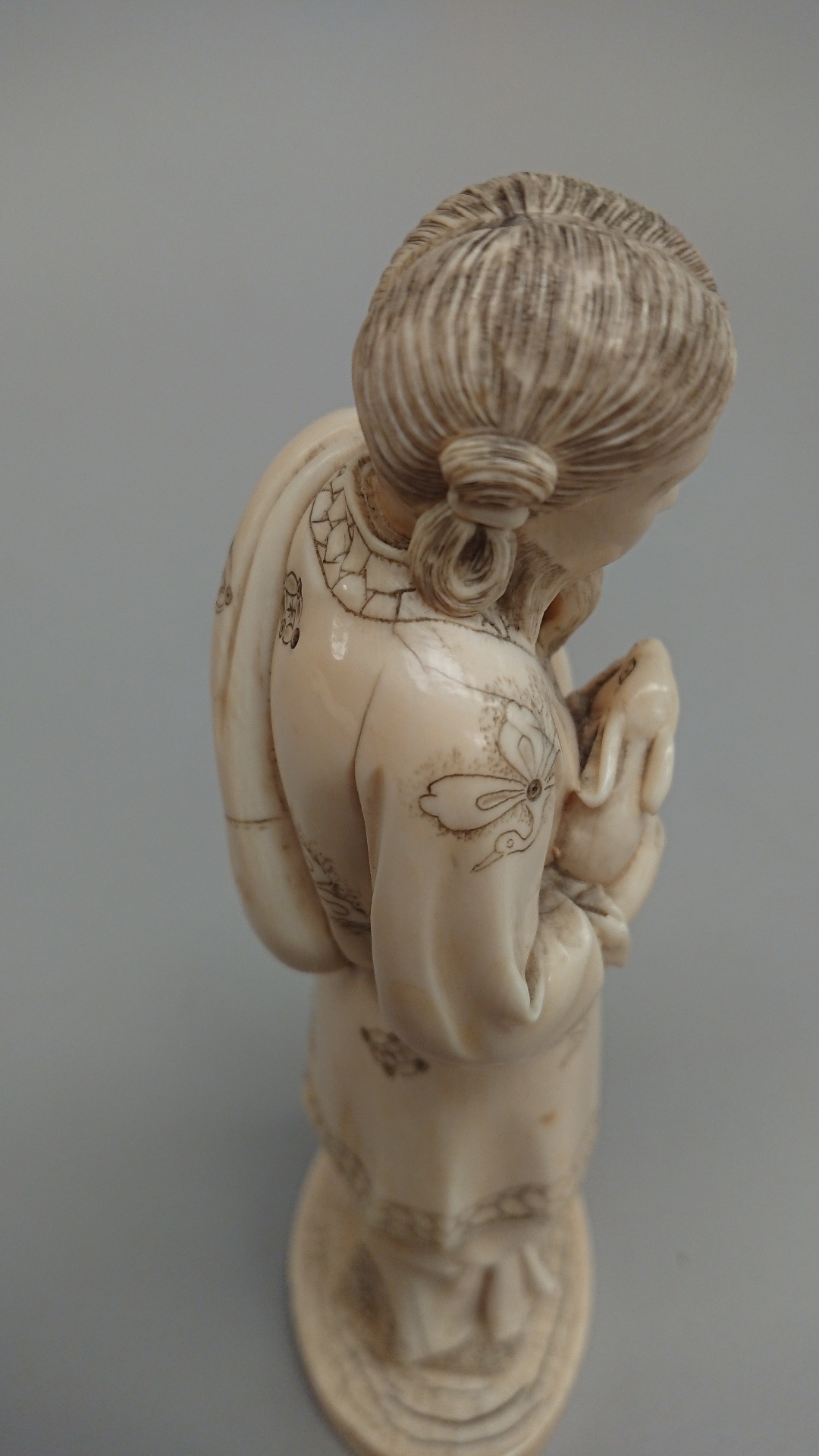 Japanese carved ivory figure, a man holding a rabbit signed to base, Meiji period. 19.5cm high - Image 6 of 7