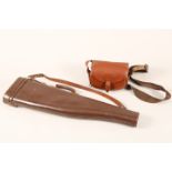 Brown leather shotgun case and carrying straps, and a brown leather cartridge bag and straps