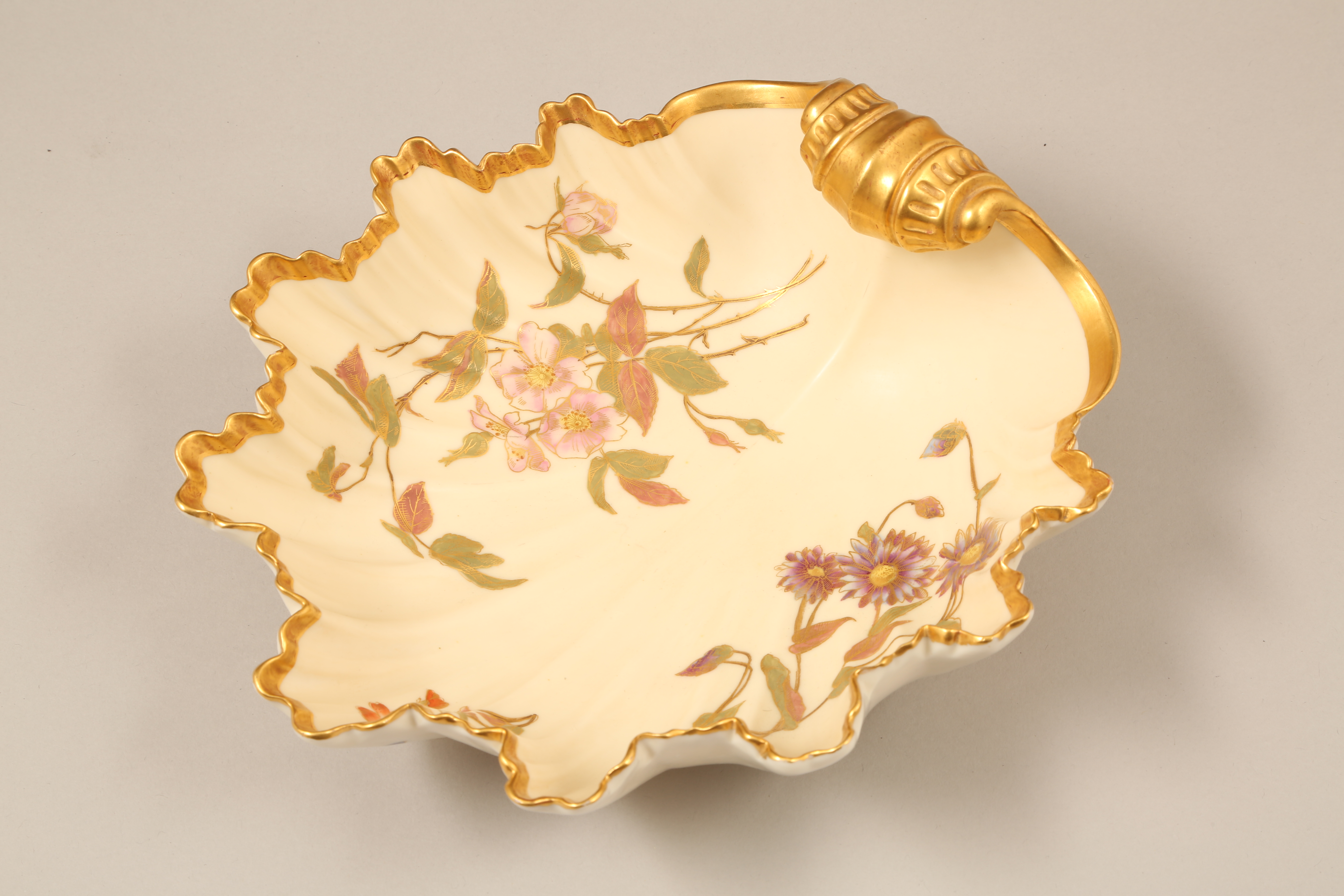 Royal Worcester scallop shaped bowl, decorated with hand painted flowers, gilt enrichments. Model