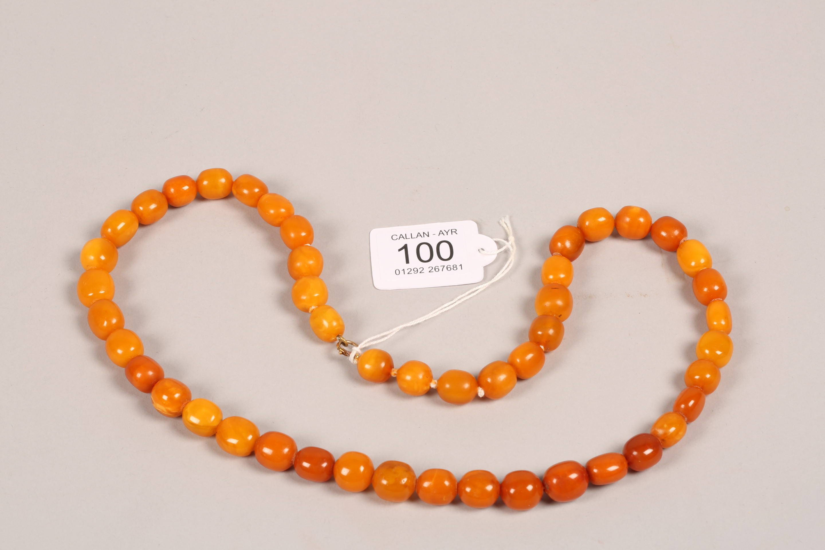 String of butterscotch amber beads. 64cm long, largest bead 20mm diameter - Image 2 of 7