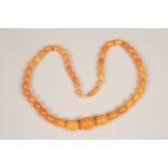 19th Century amber bead necklace (restrung) 69cm long, largest bead 20mm x 25mm. 53g