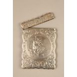 Edwardian silver card case with central panel depicting two figures on horseback. Assay marked