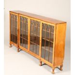 Victorian walnut bookcase, twin glazed central doors with single glazed doors either side, shelved