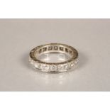 Ladies diamond eternity ring, set with 0.05 carat brilliant cut diamonds in unmarked white metal.