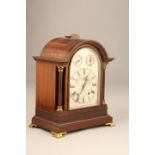19th Century mahogany cased arch top bracket clock, silvered dial, Roman numerals, chime, silent and