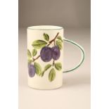 Scottish Wemyss Pottery tankard, cylindrical form, hand painted with plums signed Wemyss to base.