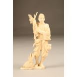 Japanese carved ivory figure, a man with a sack at his feet, Meiji period. 15cm high
