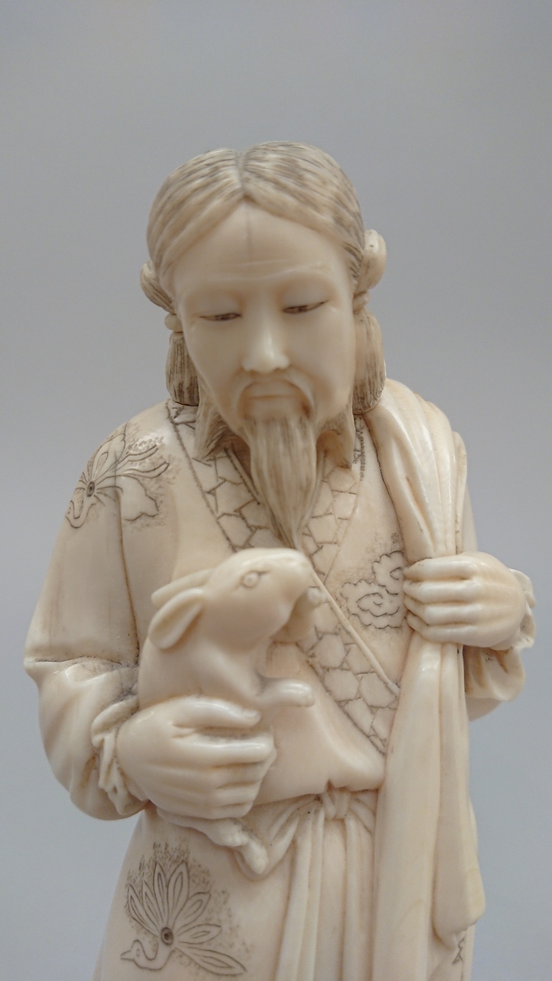 Japanese carved ivory figure, a man holding a rabbit signed to base, Meiji period. 19.5cm high - Image 4 of 7