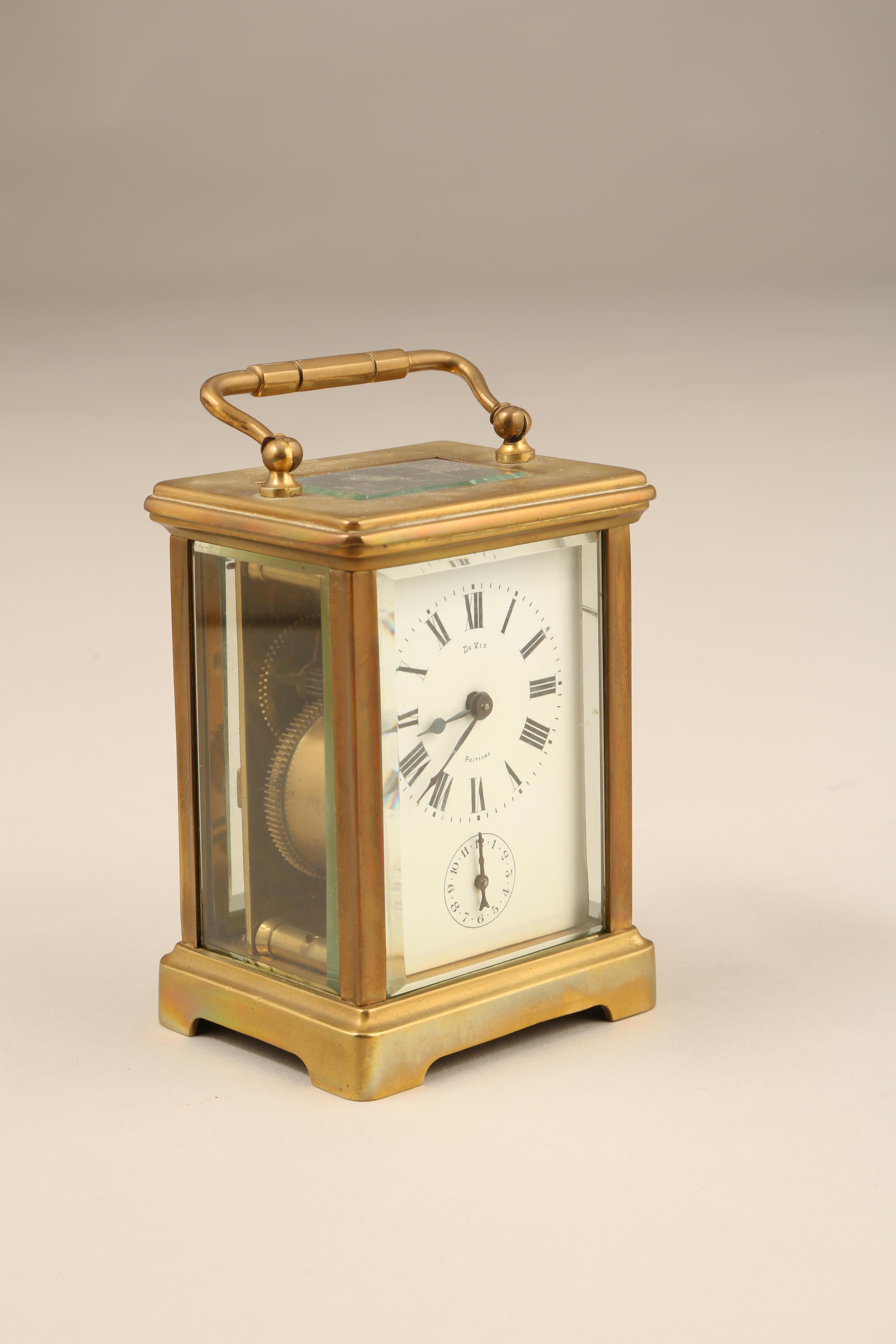 French brass carriage clock white dial and Roman numerals and an alarm dial marked De Vis