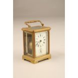 French brass carriage clock white dial and Roman numerals and an alarm dial marked De Vis