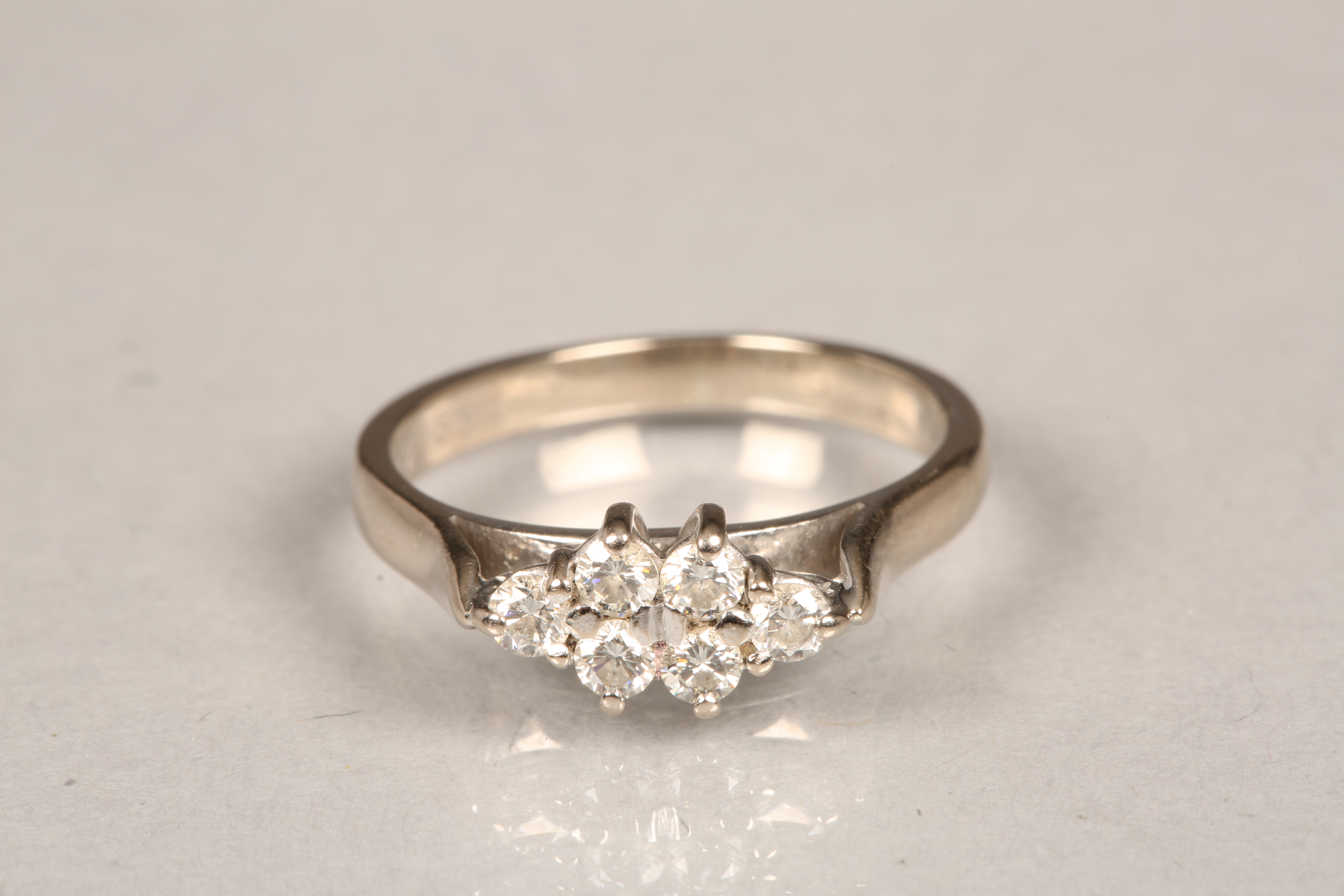 18 carat white gold diamond cluster ring. Six brilliant cut diamonds measuring 0.05carat each.