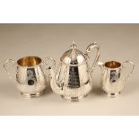 Victorian three piece silver tea service with chased floral decoration and gilded interior. Assay