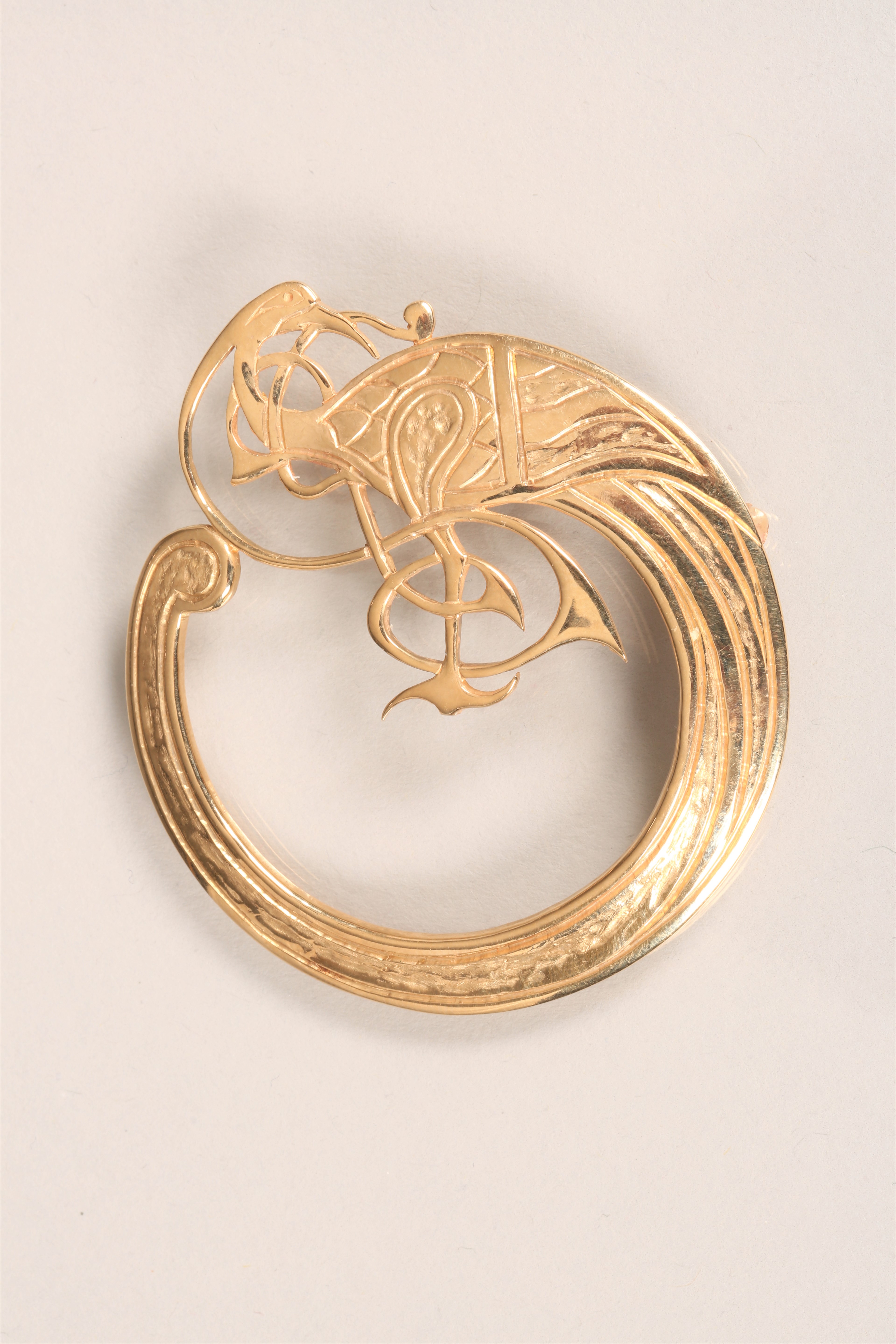 9 carat gold circular brooch by Tain Silver. Stylised Celtic bird motif. Stamped TAIN to reverse