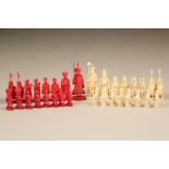 32 piece Eastern carved ivory chess set, one side natural the other is stained red. 10cm high