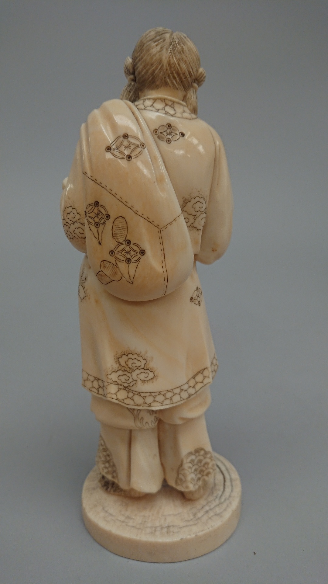 Japanese carved ivory figure, a man holding a rabbit signed to base, Meiji period. 19.5cm high - Image 2 of 7