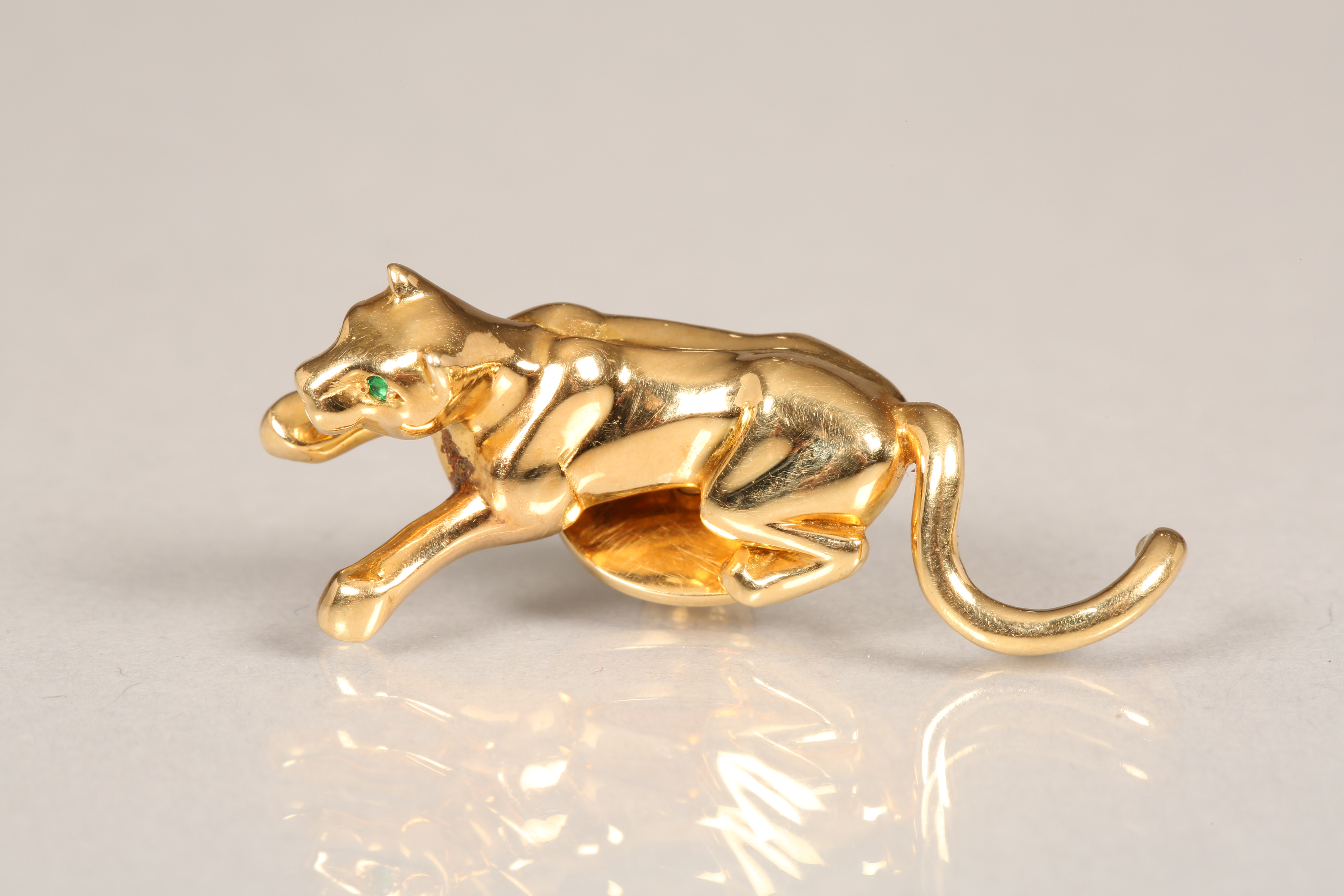 Cartier 18 carat gold panther tie pin with emerald eyes signed Cartier No607004 stamped 750 with