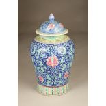 A large 20th Century Chinese vase and cover, baluster form, blue ground with floral and foliate