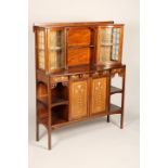 An Art Nouveau mahogany cabinet, twin leaded glass cabinets with central shelf above inlaid floral