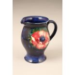 Moorcroft pottery jug, anemone pattern, signed to base, 15.5cm high