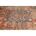 A fine Persian rug, rectangular, blue ground with assorted panels depicting temples, urns, deer