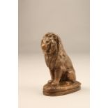 19th Century bronze lion assis, signed Barye. 19.5cm high