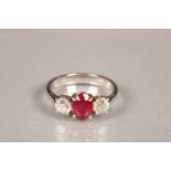 Ladies 18 carat white gold ruby and diamond ring, central ruby flanked by a brilliant cut diamond on