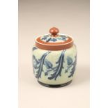 McIntyre Florian ware lidded jar, stylised floral pattern, 14cm high