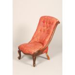 Victorian mahogany nursing chair, low scroll backed raised on short cabriole legs