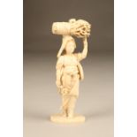 Japanese carved ivory figure, a lady gathering firewood signed to base, Meiji period. 23cm high