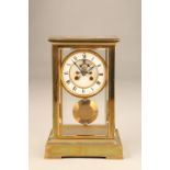 French gilt brass four glass mantel clock with white enamel dial and Roman numerals, movement