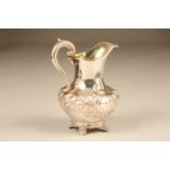 Victorian silver embossed cream jug with floral and leaf decoration, assay marked London 1865 by